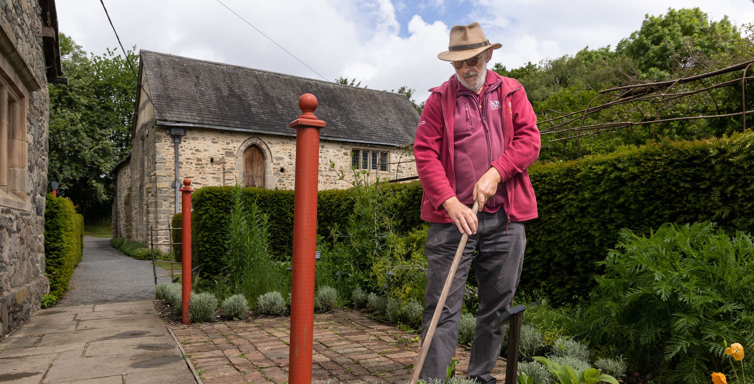 Garden Volunteeer Tending The Dye Garden Aspect Ratio 785 400